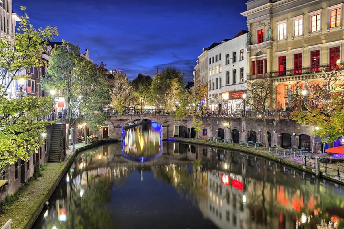 a canal in the middle of a city at night