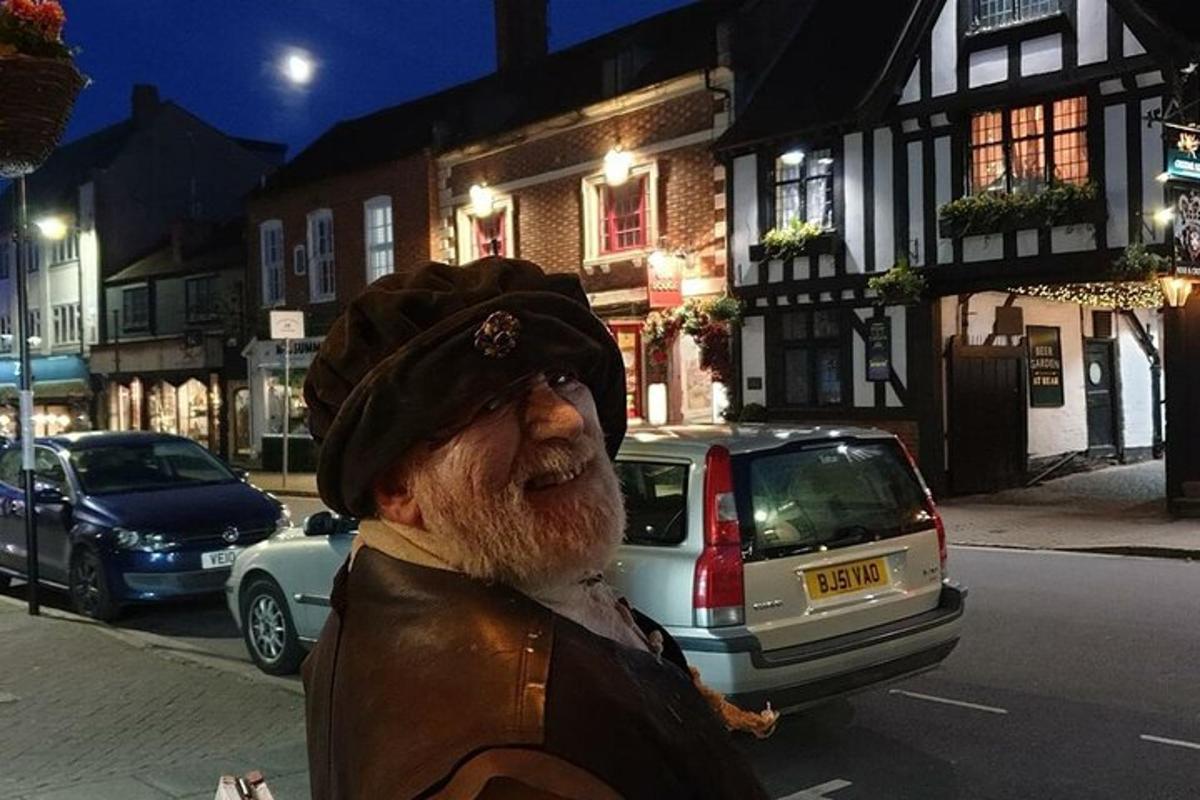 an older man is standing on a city street