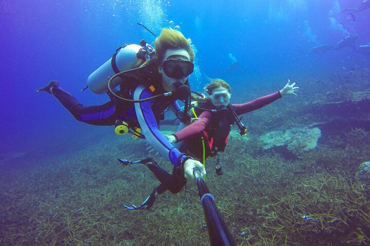 a man and a little girl in a scuba diver