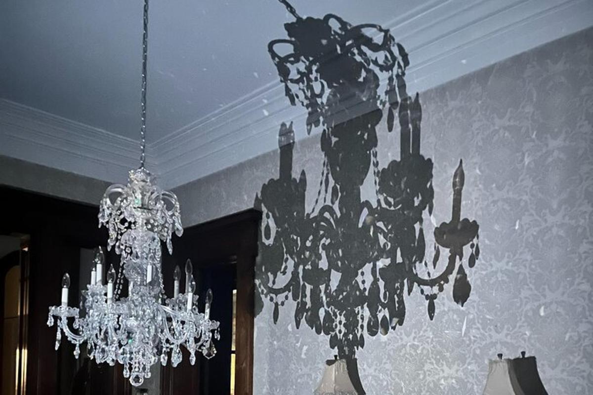 a chandelier hanging from a ceiling in a room