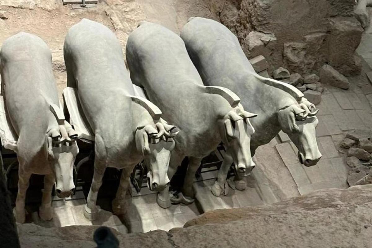 a statue of four cows standing next to each other