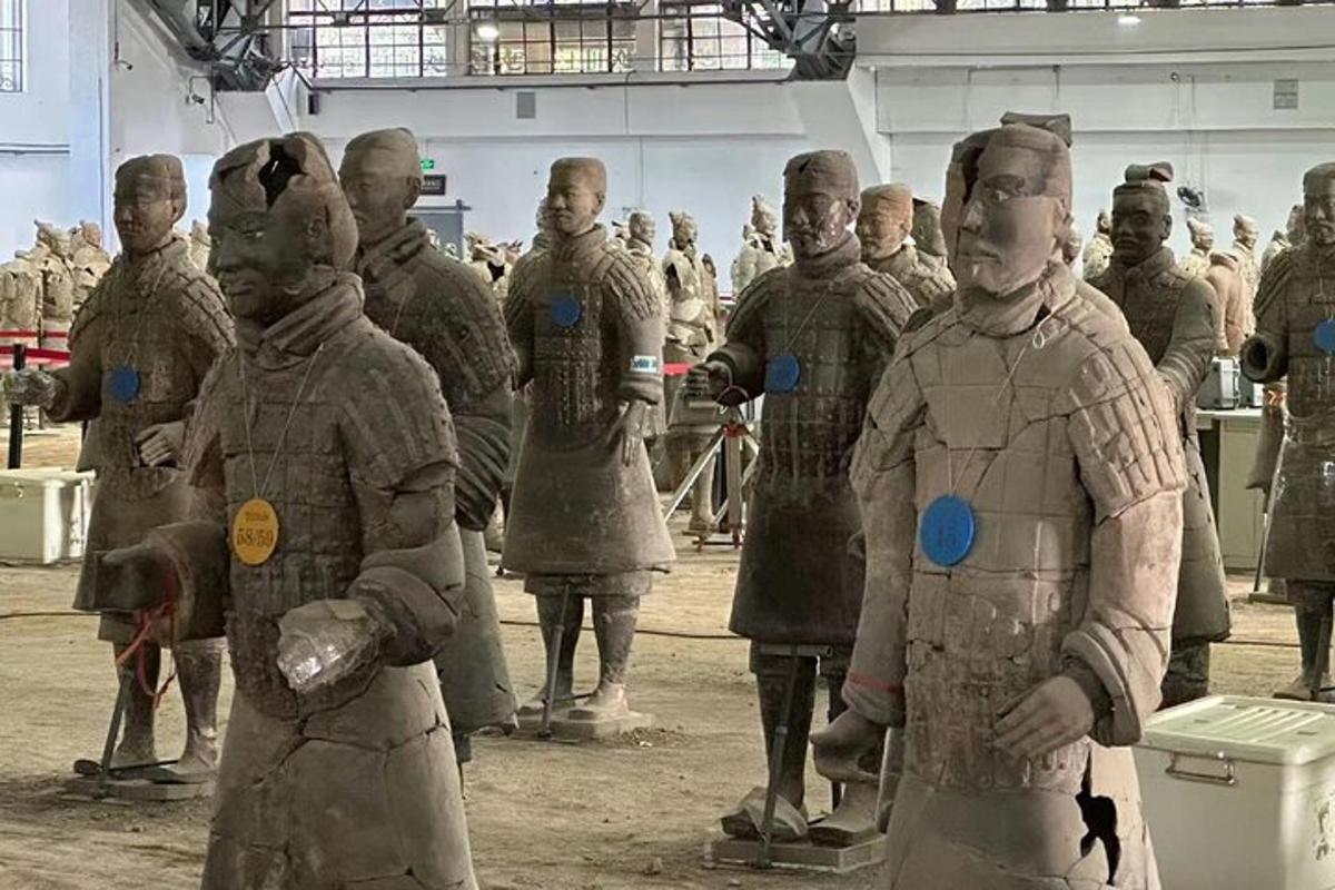 a group of people dressed in armor standing in a building