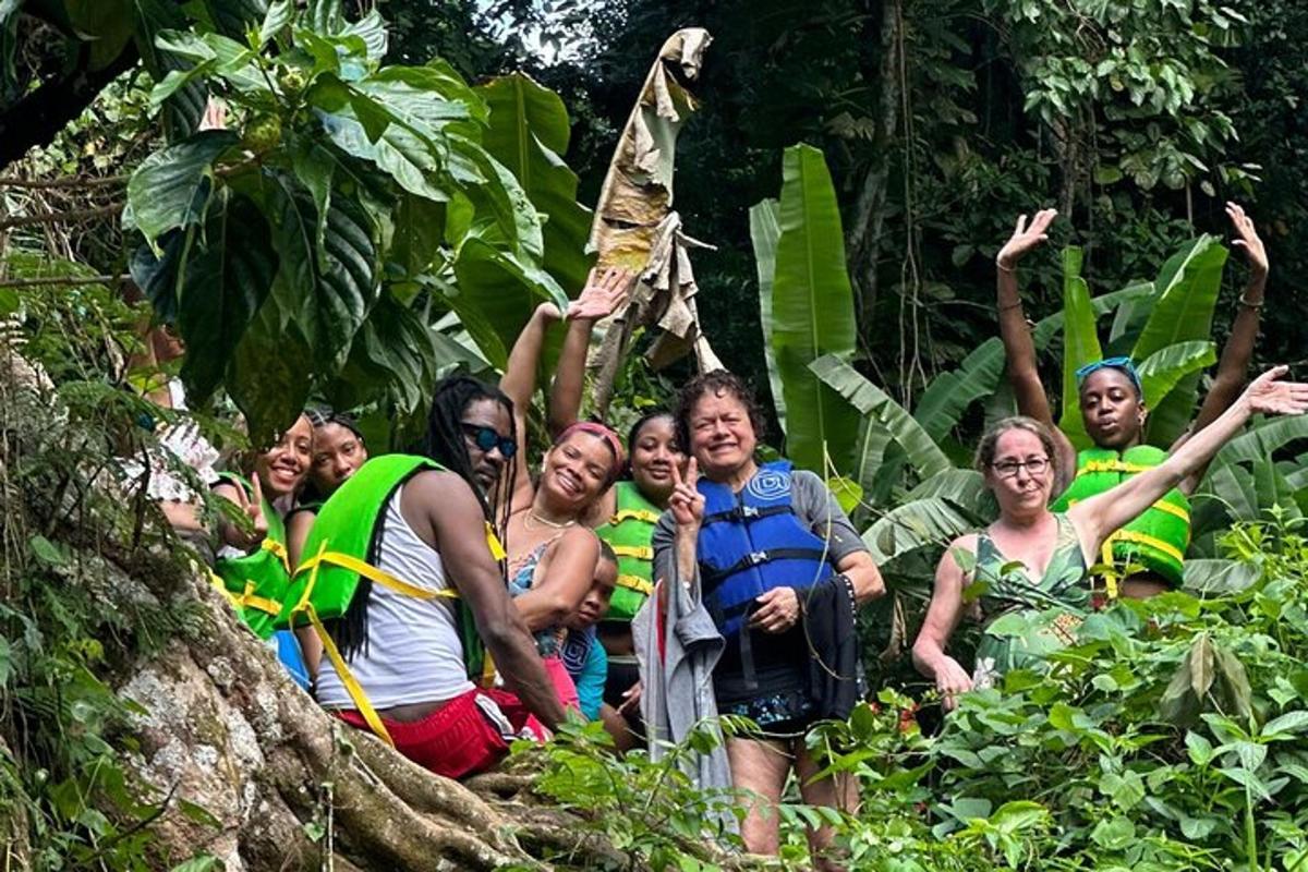a group of people posing for a picture in the jungle