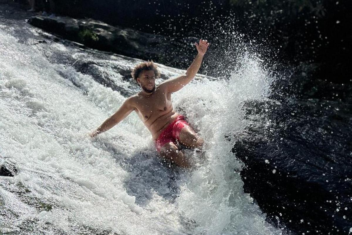 a man on a surfboard in the water