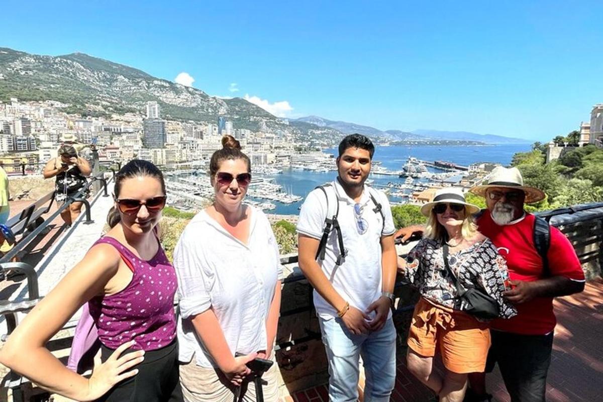 a group of people posing for a picture on a mountain