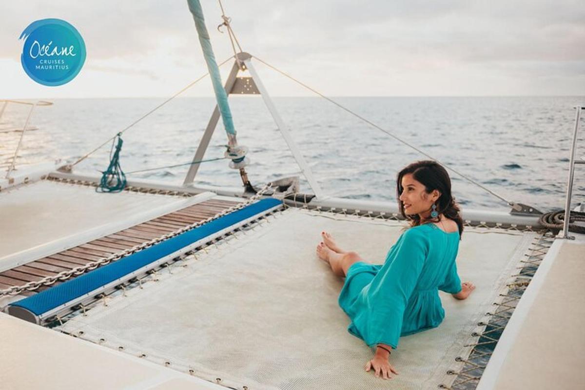 a woman sitting on the deck of a boat