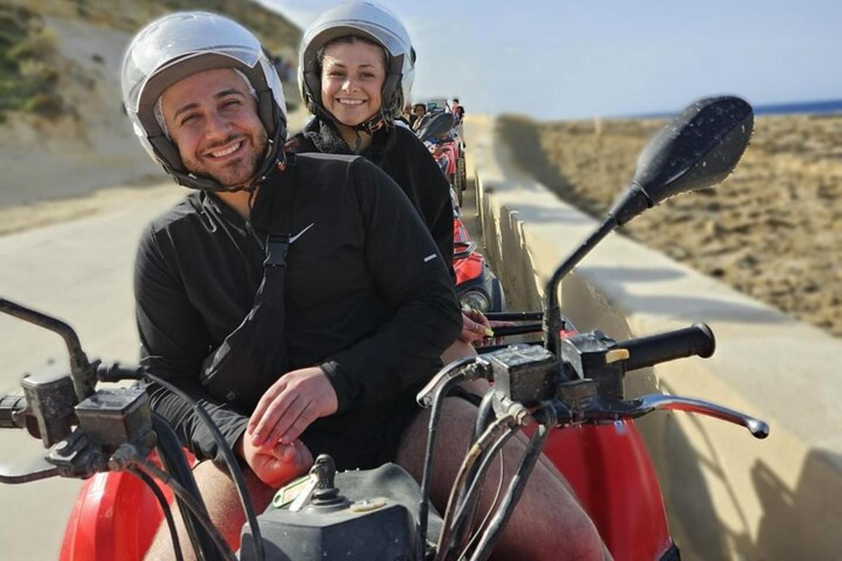 a man and a woman riding on a motorcycle