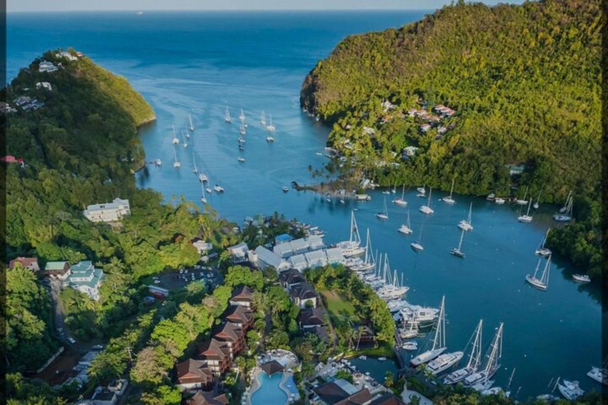 an aerial view of a harbor with boats in the water