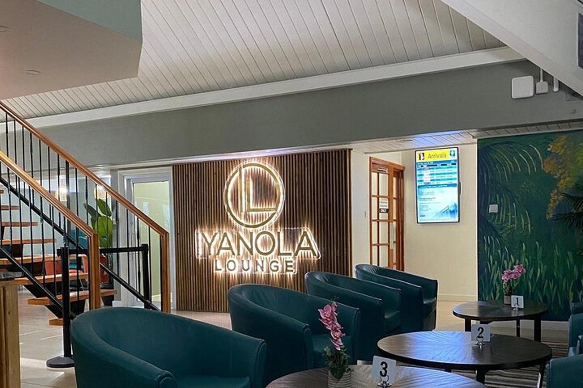 a lobby with blue chairs and a sign that reads yoyo lounge