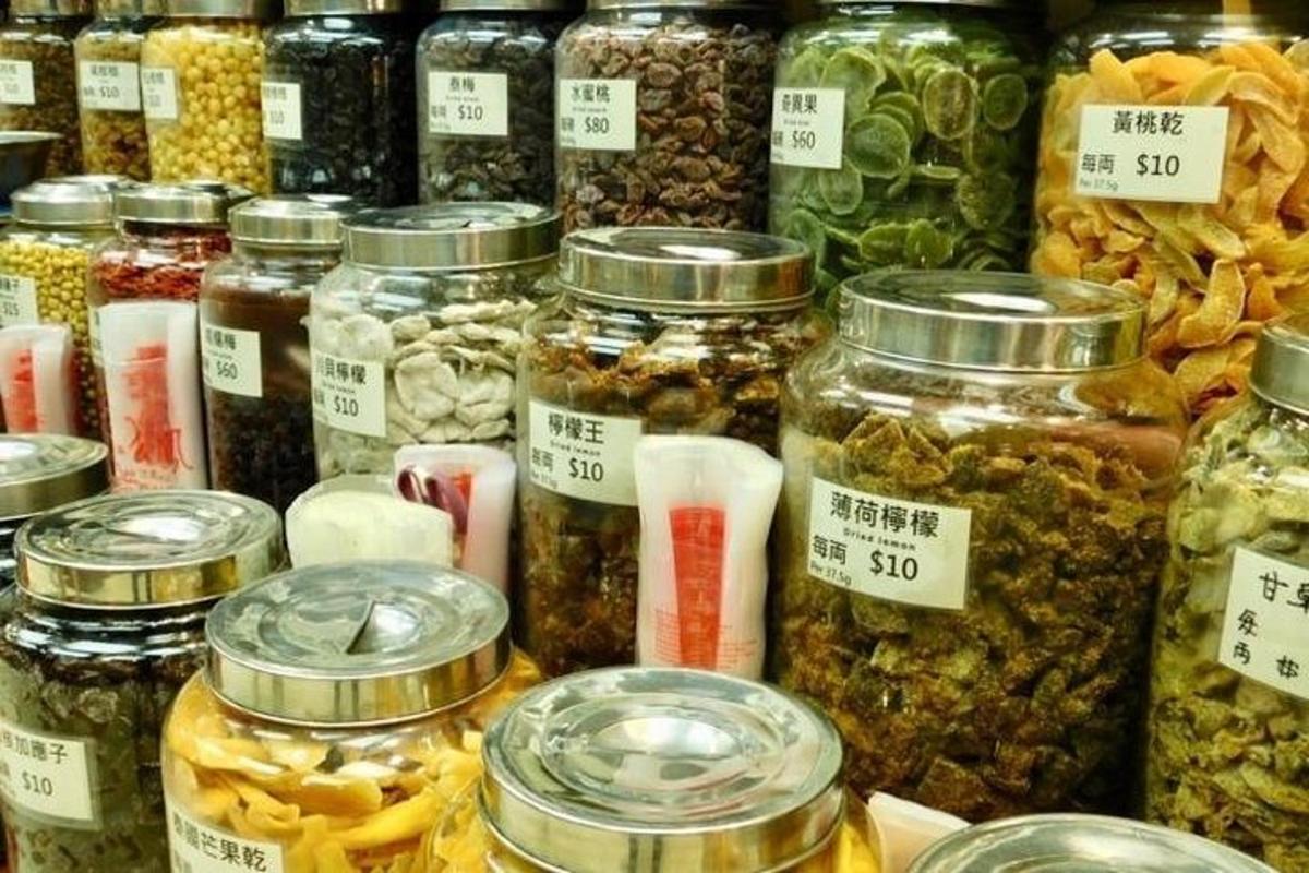 a bunch of jars of food on display in a store