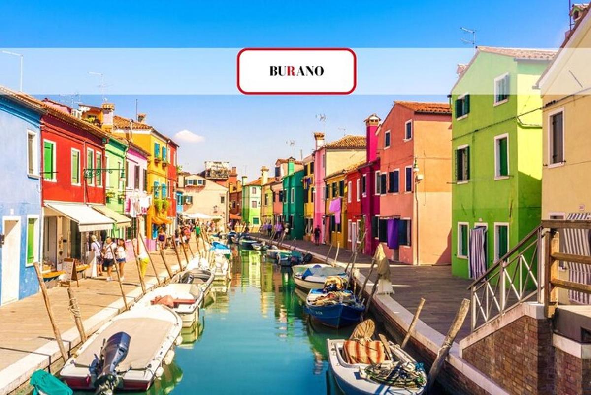 a view of a canal with colorful buildings and boats