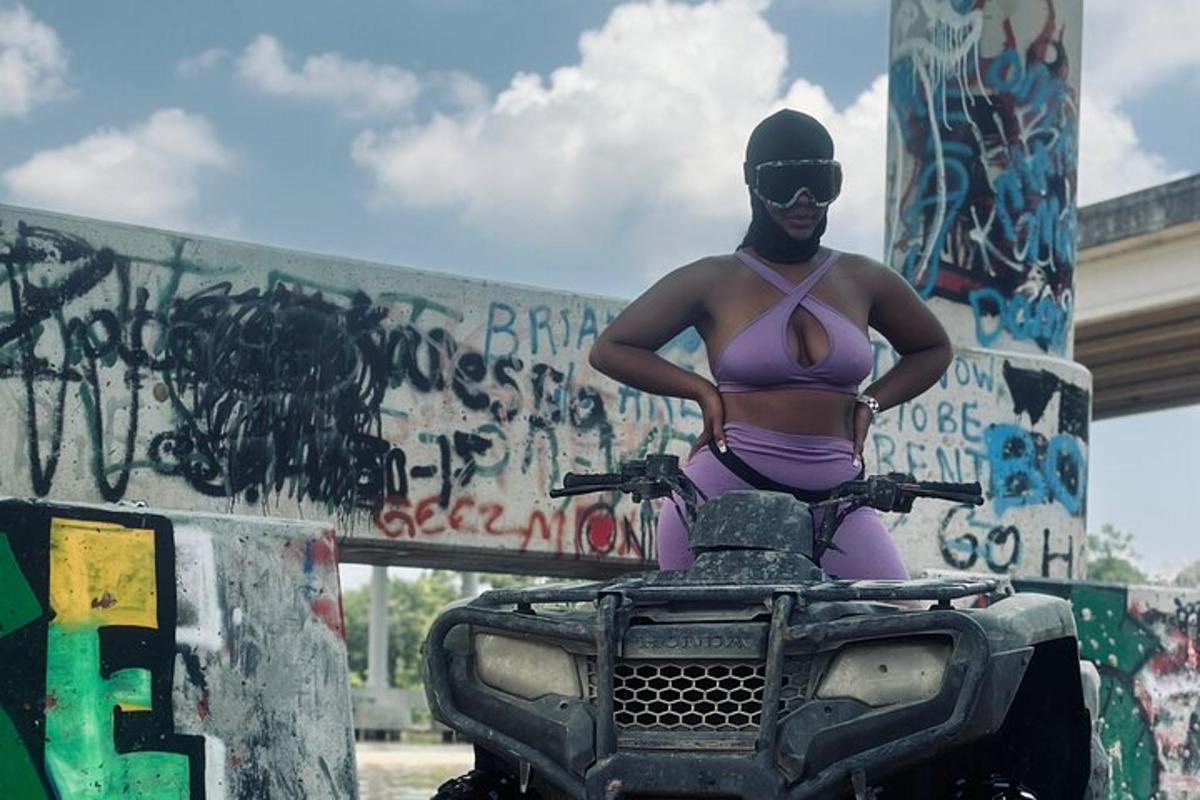 a woman in a bikini riding a quad bike