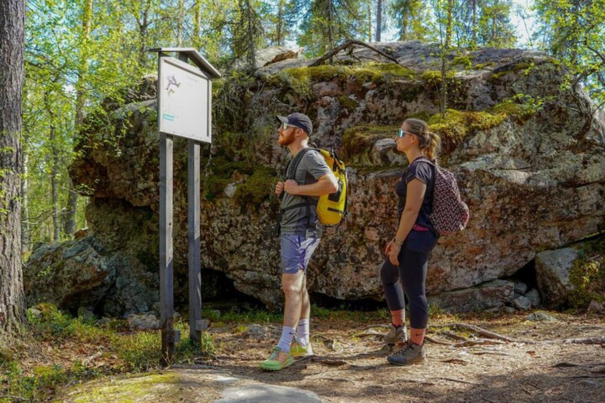 a man and a woman standing next to a sign