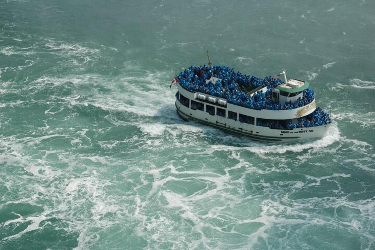 a group of people on a boat in the water