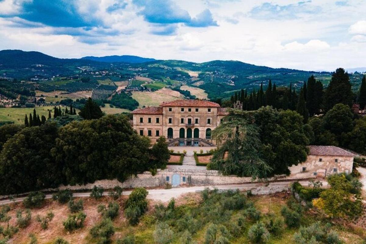 an aerial view of a building on a hill