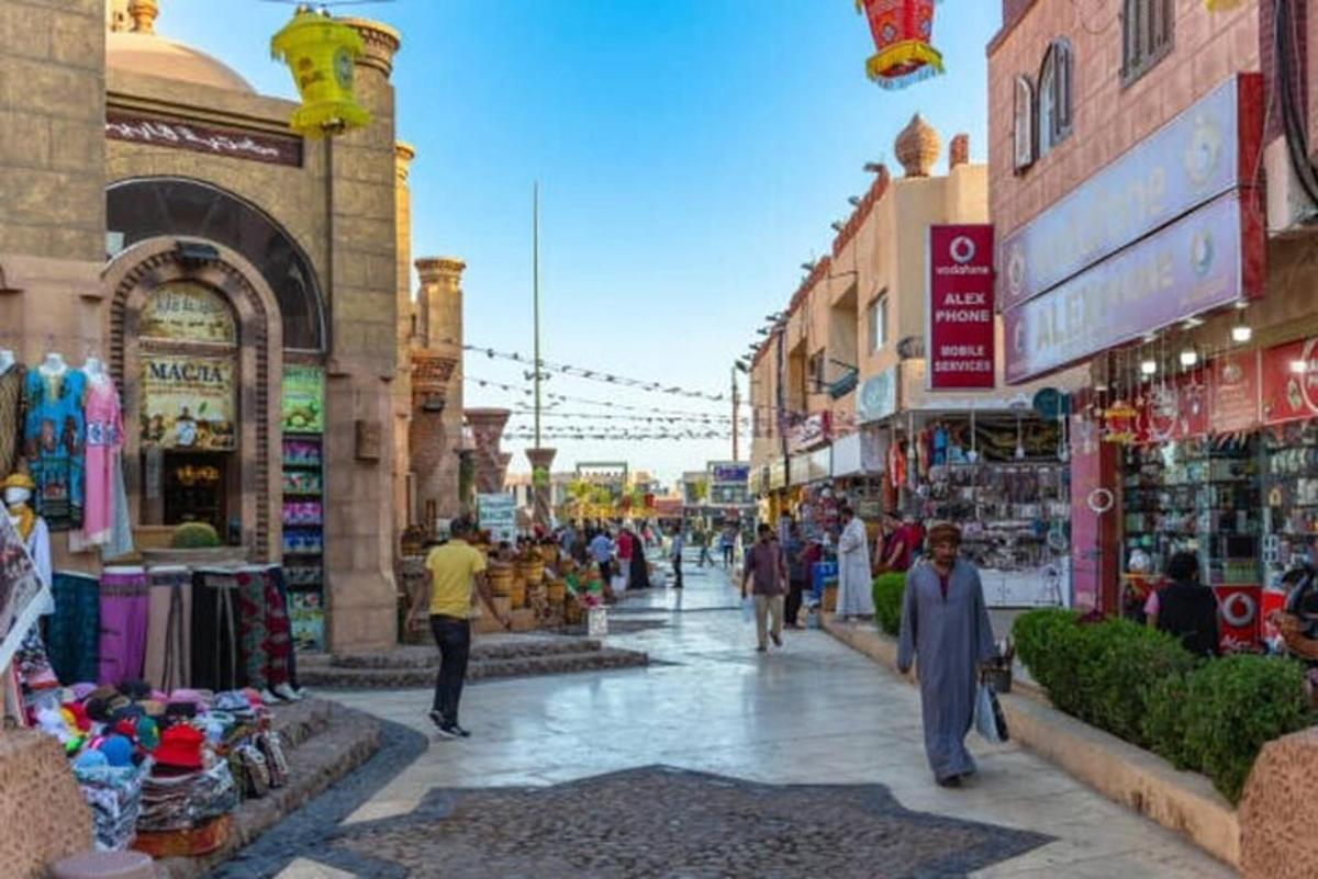 a group of people walking through a street market