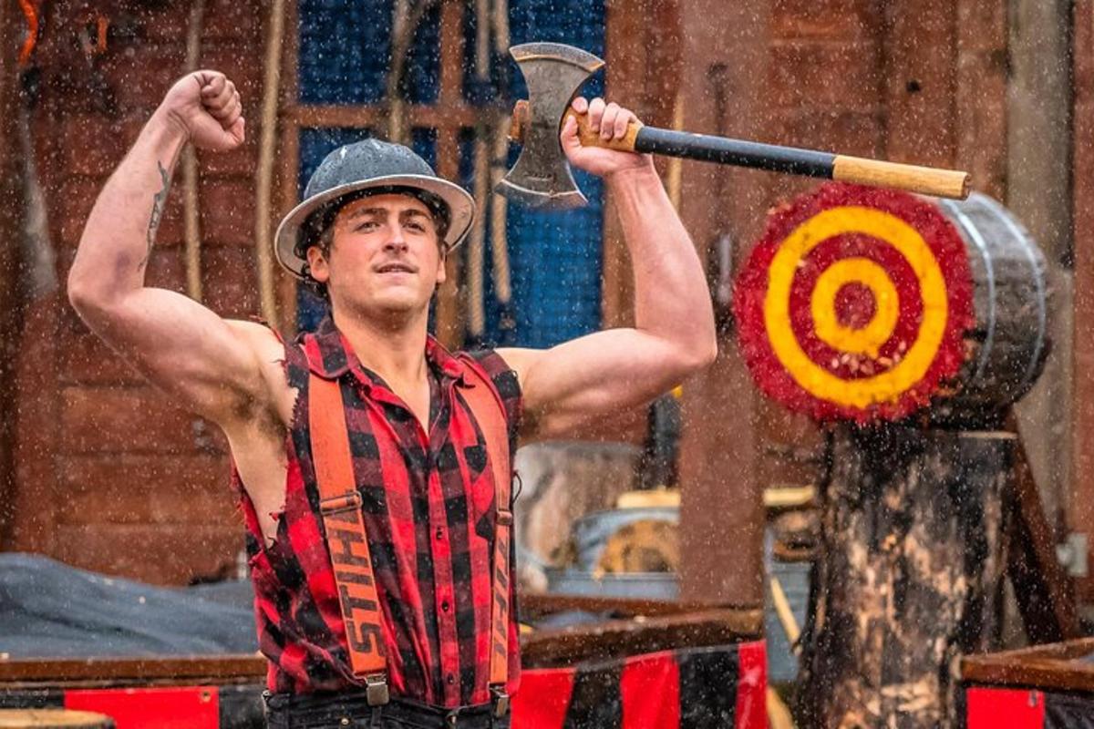 a man in a hat holding a spear and a target