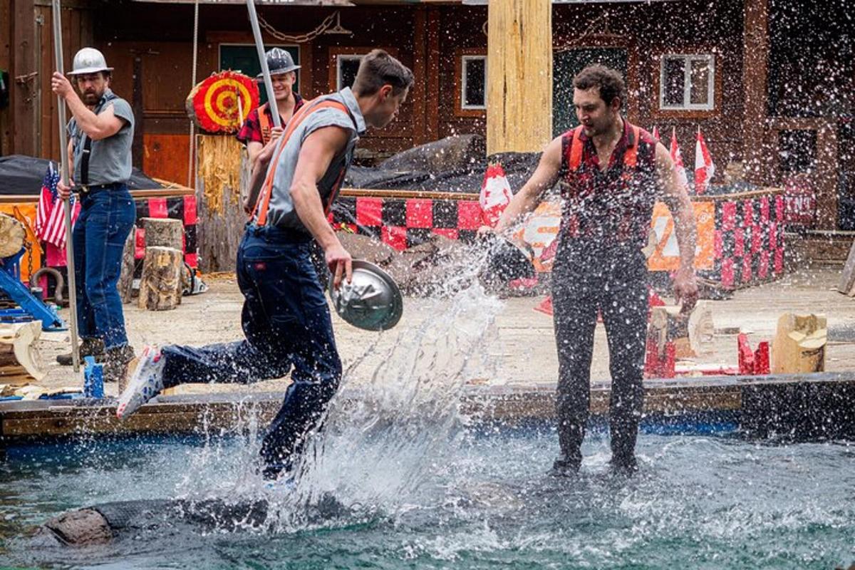 two men playing in the water in a fountain