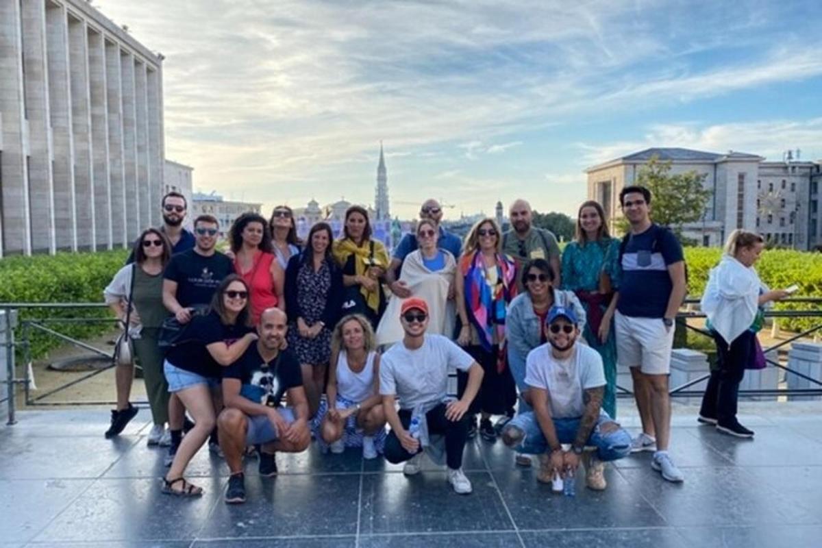 a group of people posing for a picture on a roof