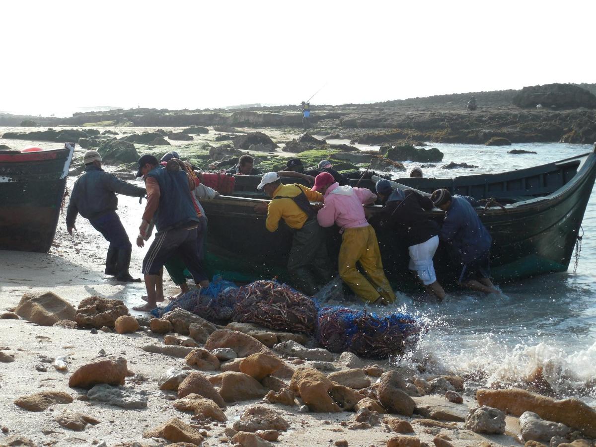 a group of people on a boat in the water