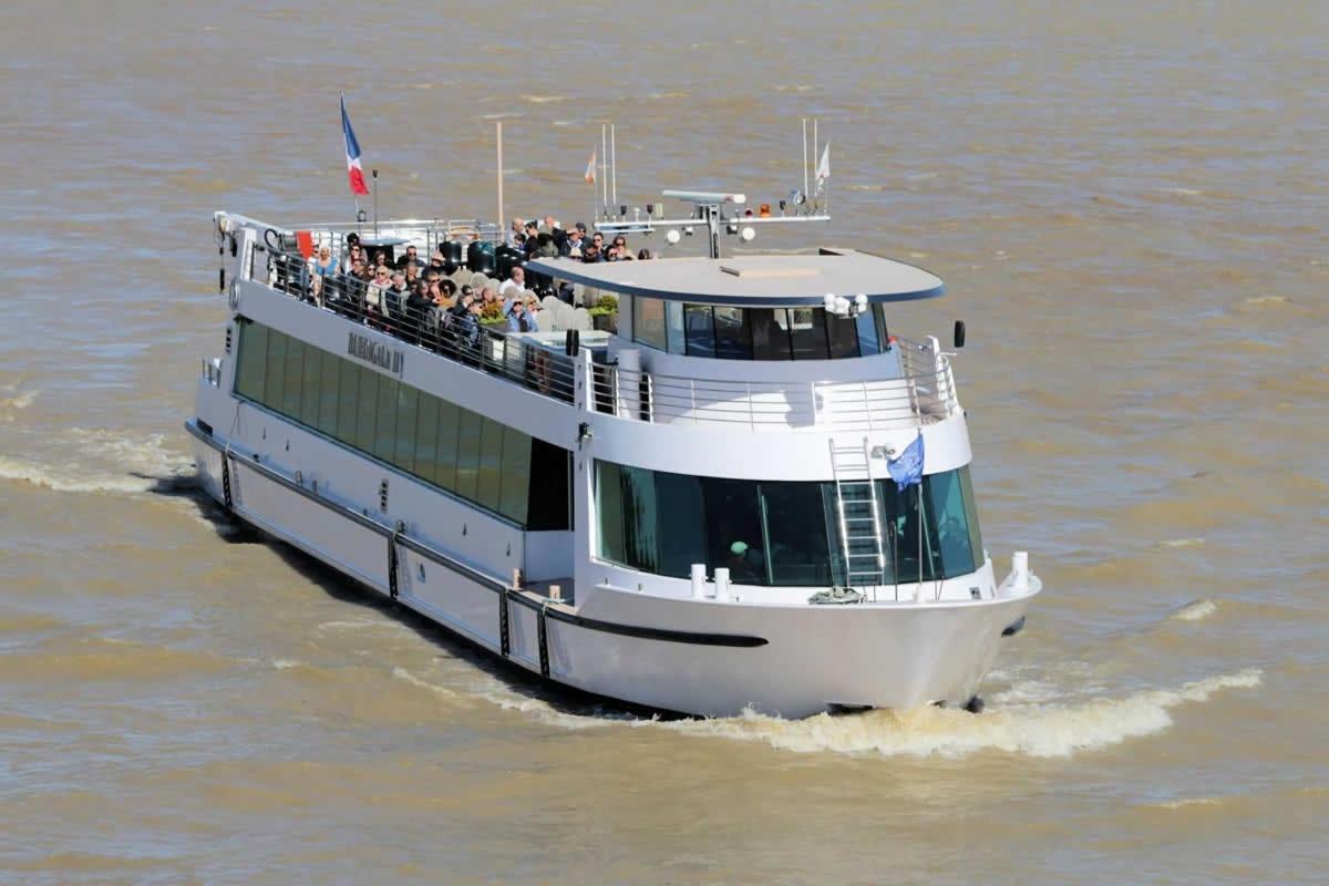 a ferry boat with people on it in the water