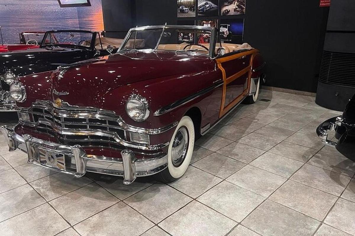 an old car is on display in a museum