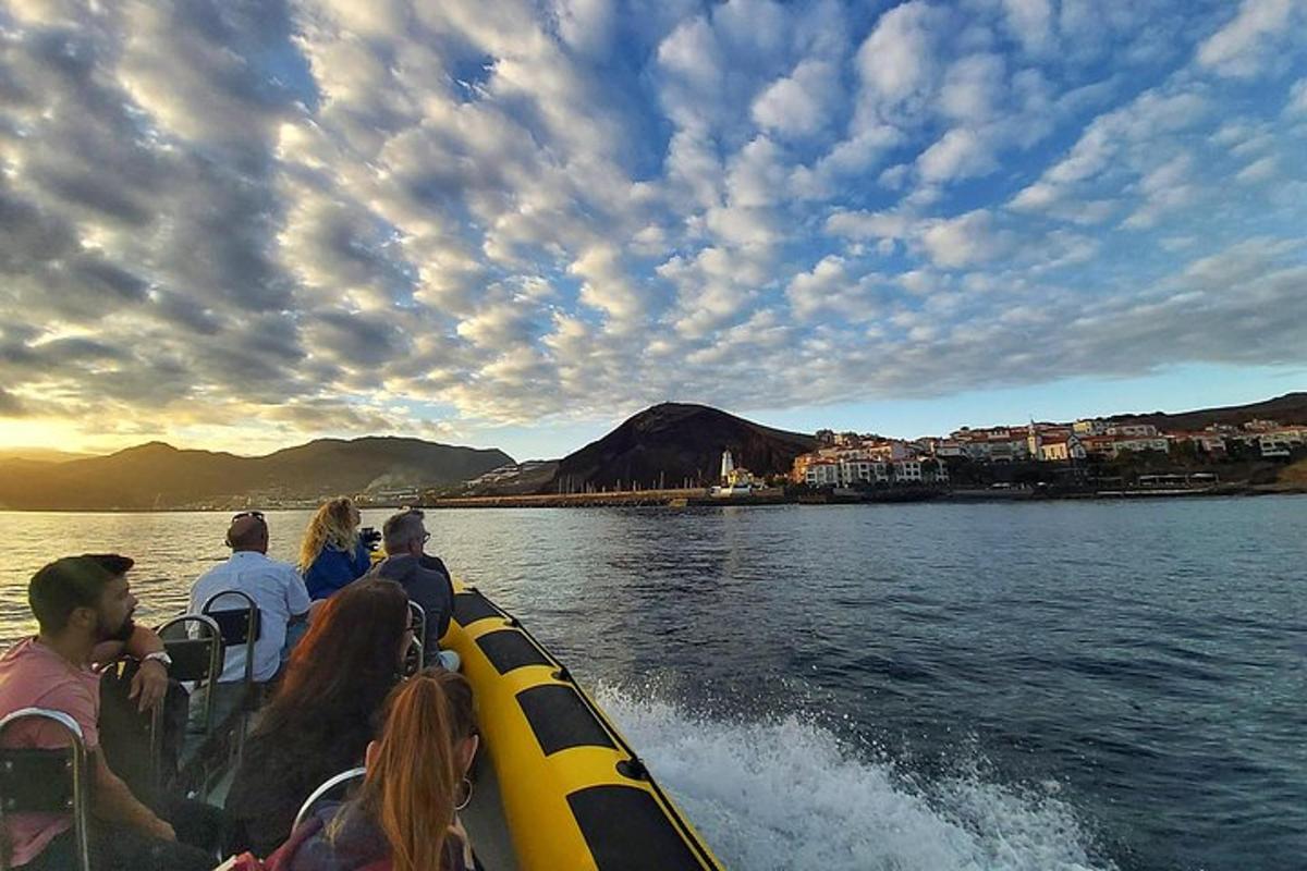 a group of people on a boat on the water