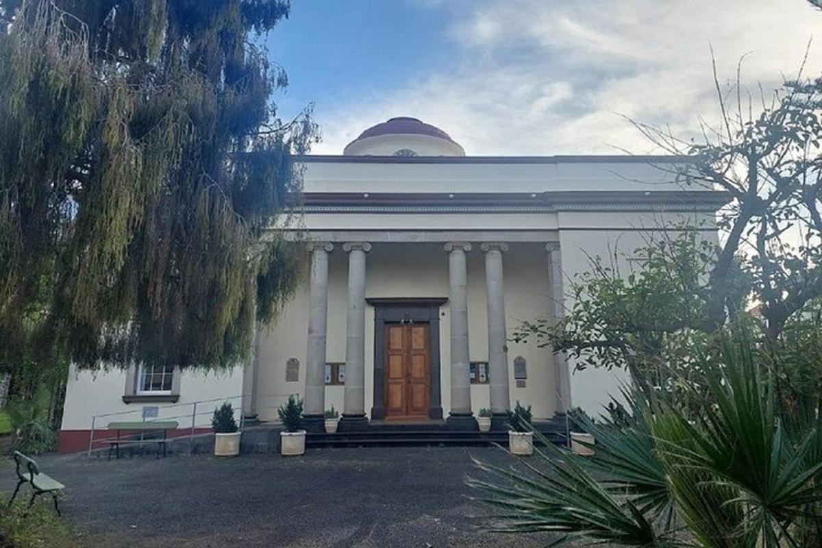 a large white building with a wooden door
