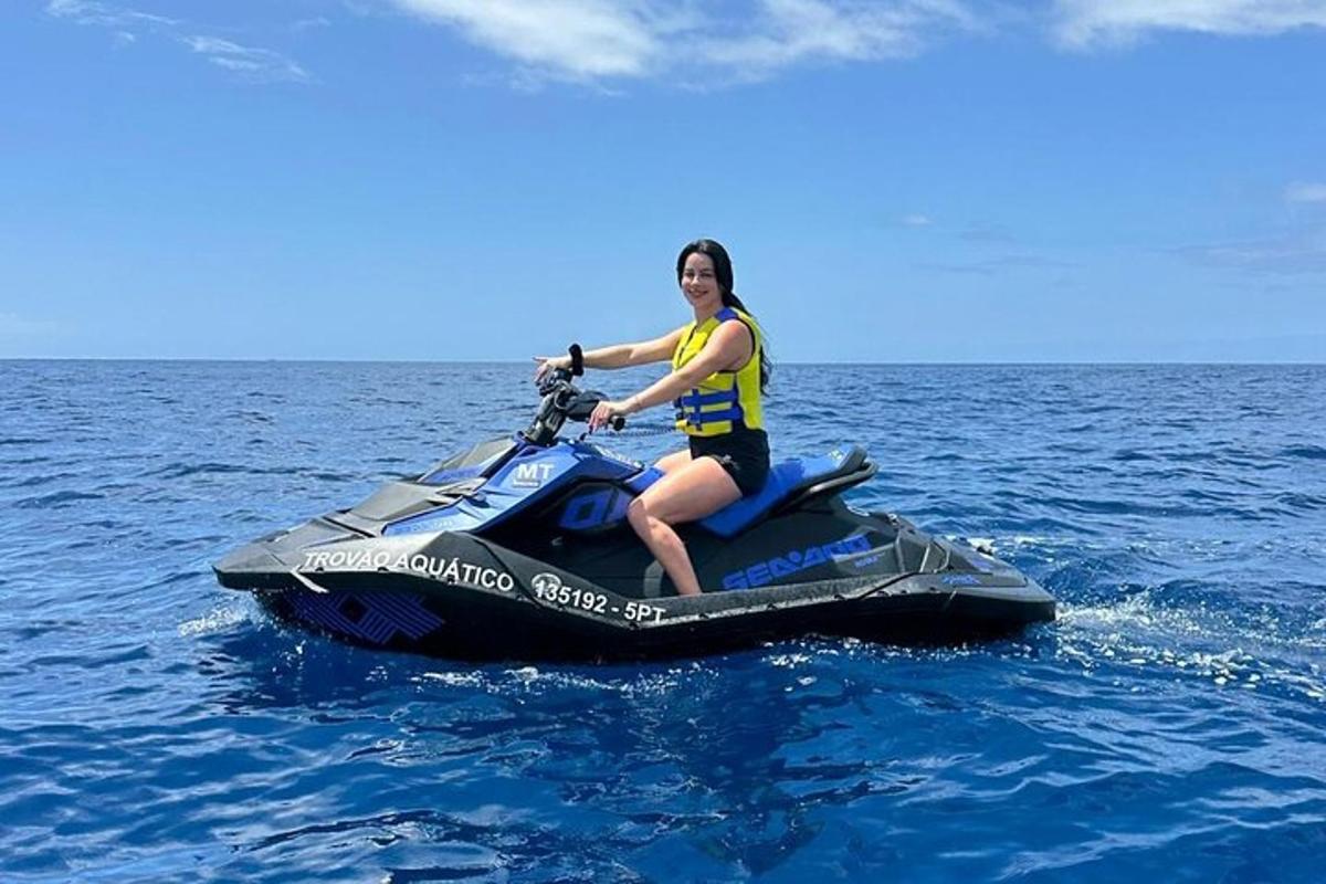 a woman riding on a jet ski in the water