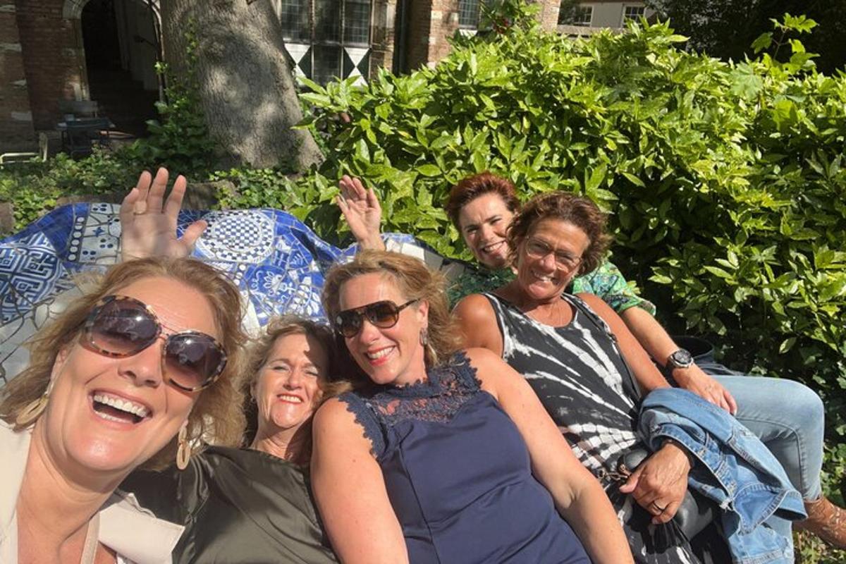 a group of people sitting on a blanket