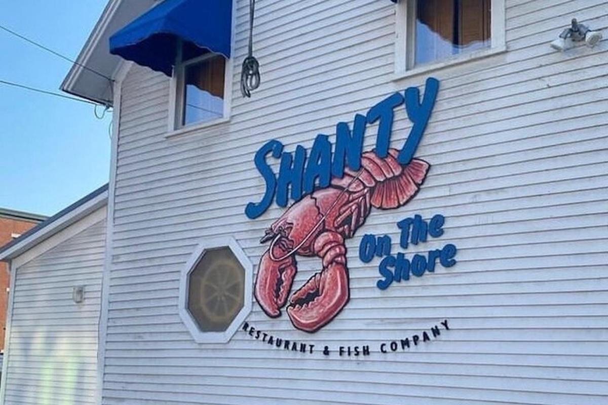 a seafood sign on the side of a building
