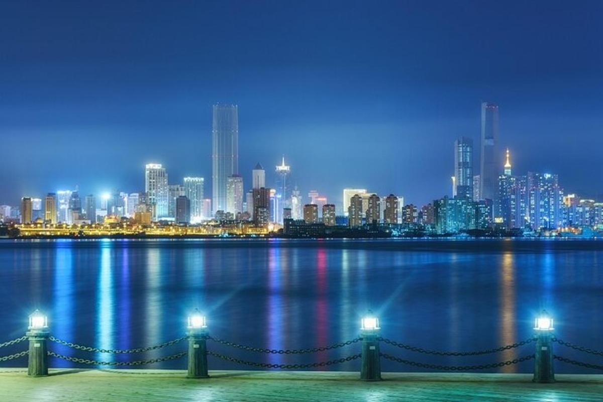 a view of a city from the water at night