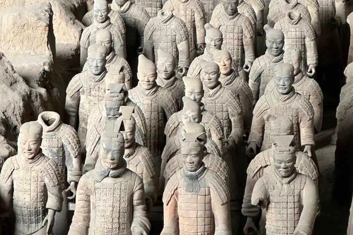 a black and white photo of a group of statues