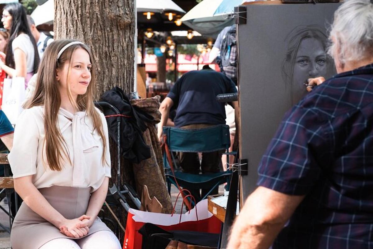 a woman sitting on the ground next to a man