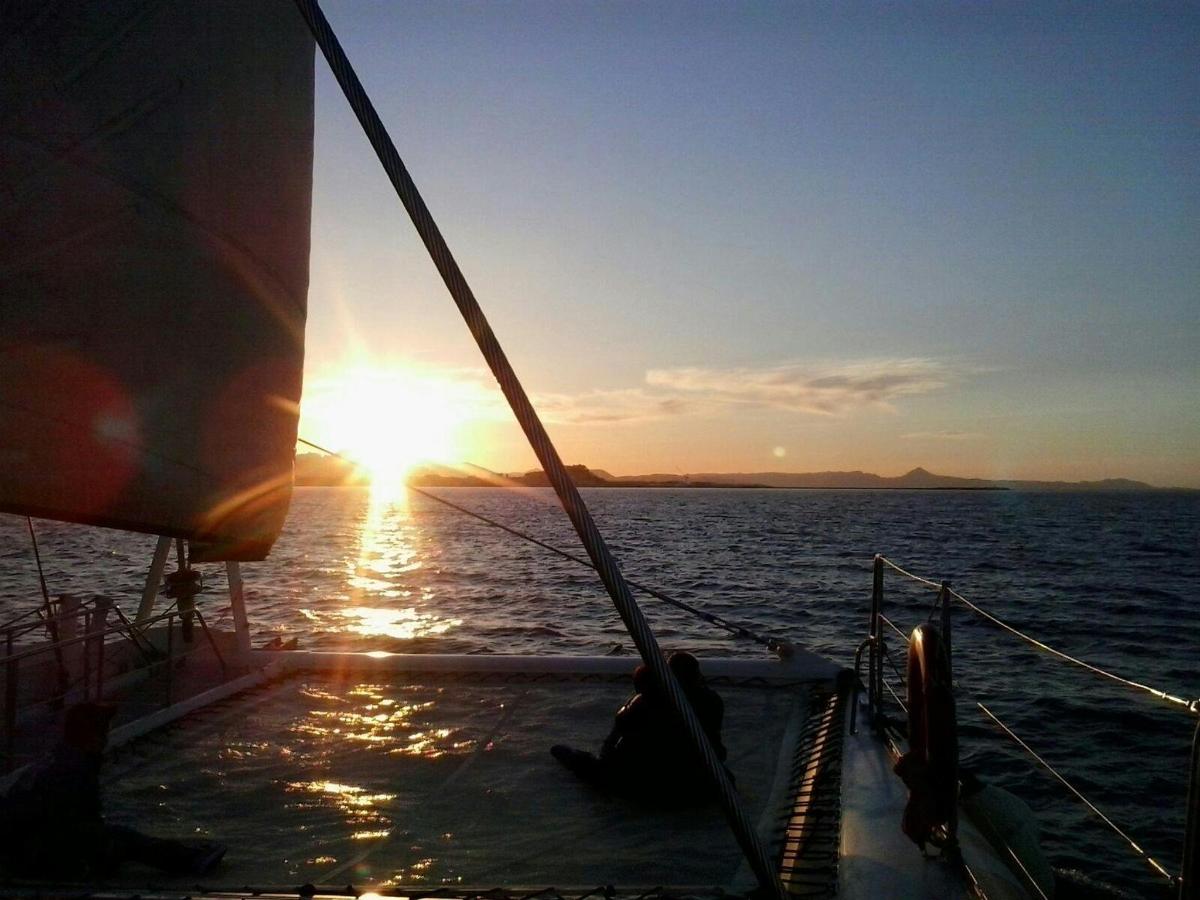 a sunset on a boat in the water