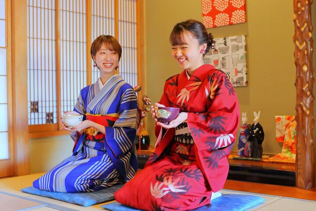 two women in kimonos sitting on the floor