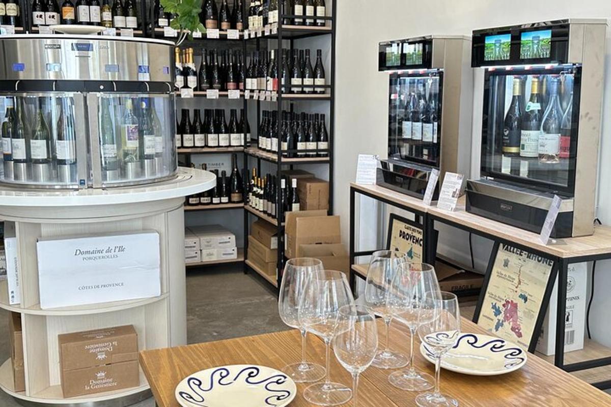 a wine store with wine glasses on a table