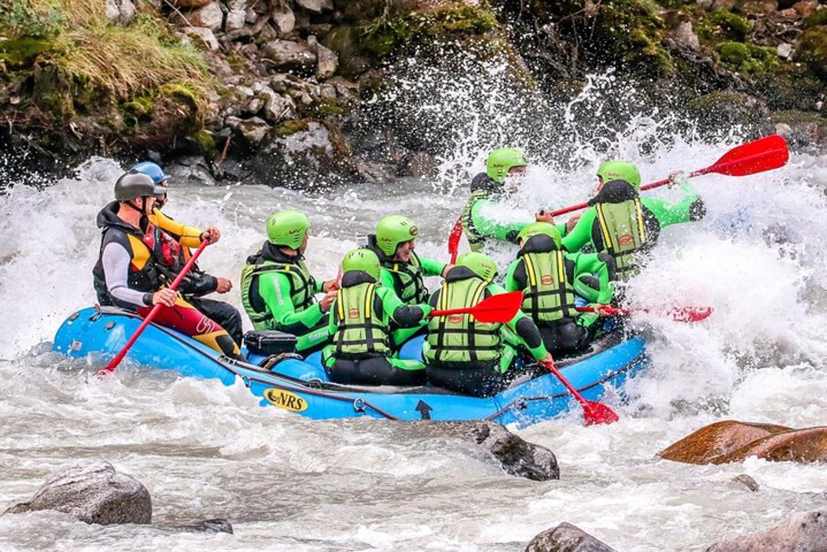 a group of people in a raft in a river