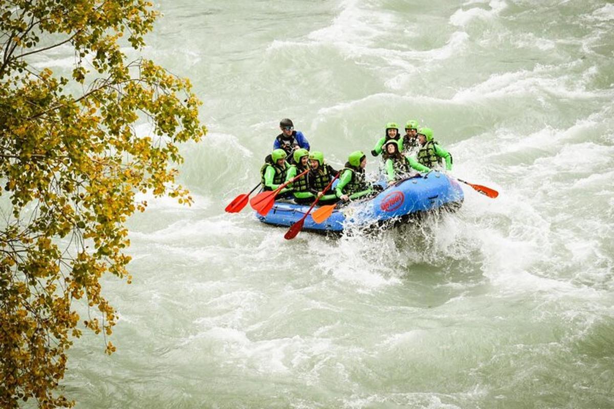 a group of people in a raft on a river