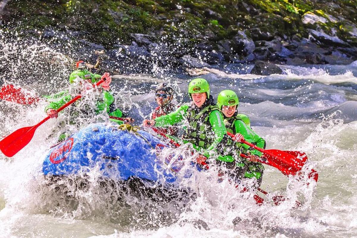 a group of people in a raft in a river