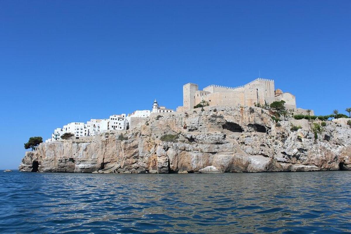 a castle on a cliff in the water