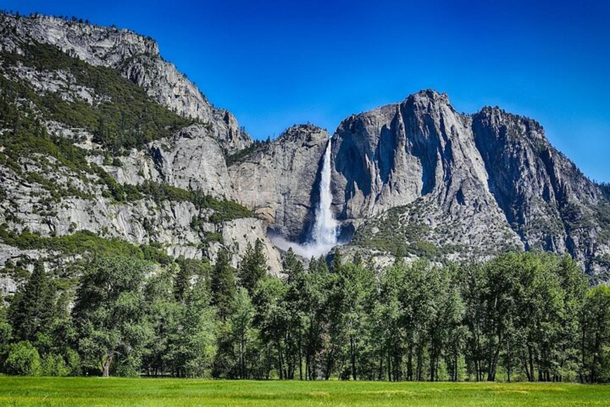 a waterfall in the middle of a mountain
