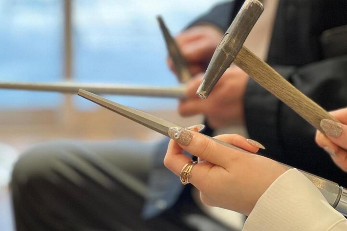 a person holding a pair of scissors in their hands