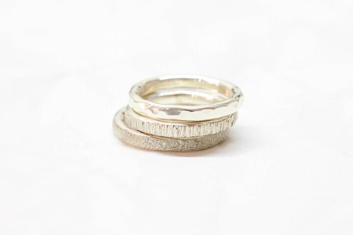 a white gold engagement ring with a stone