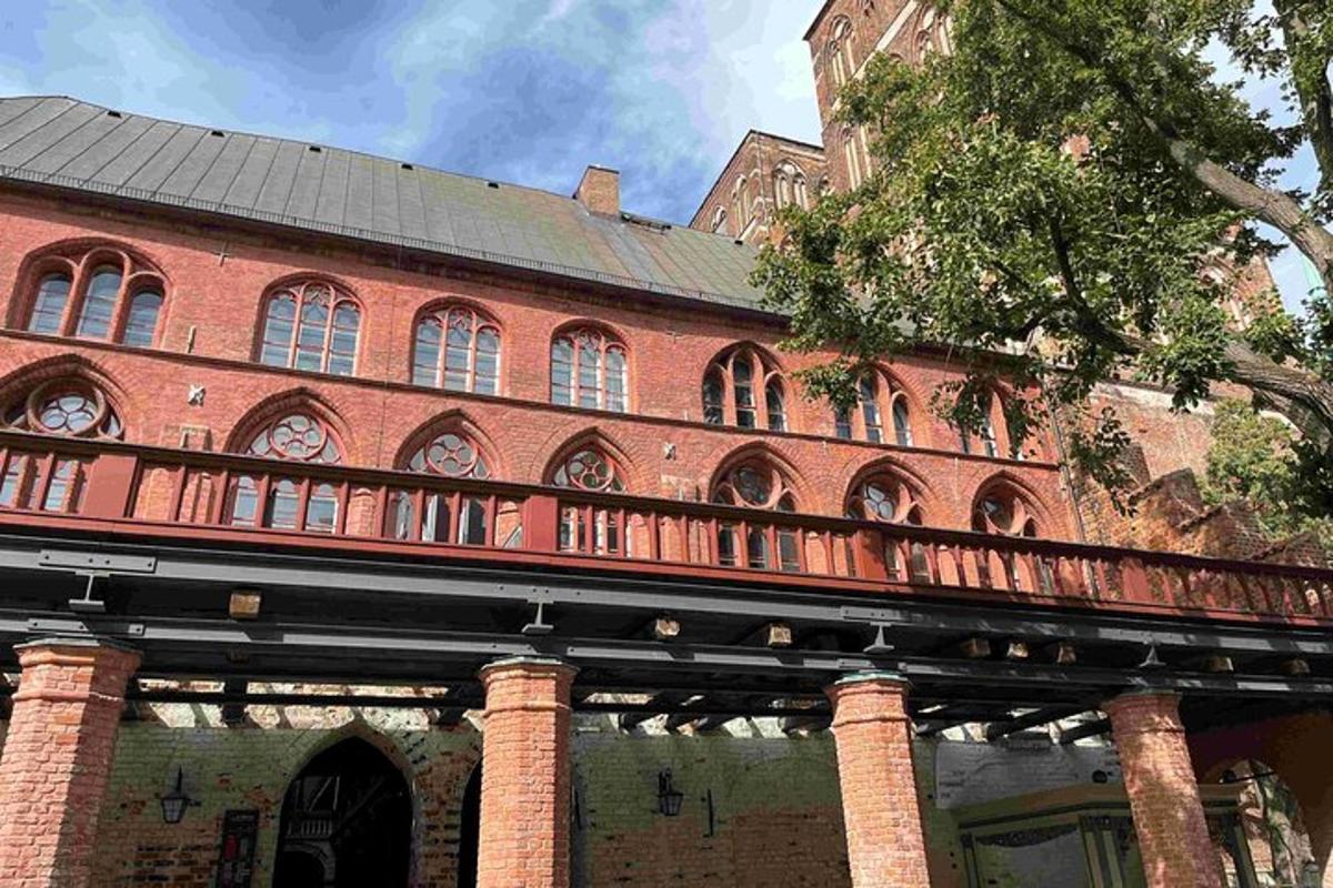 a large red brick building with a clock tower