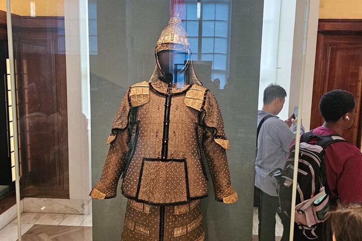 a man in a costume on display in a museum