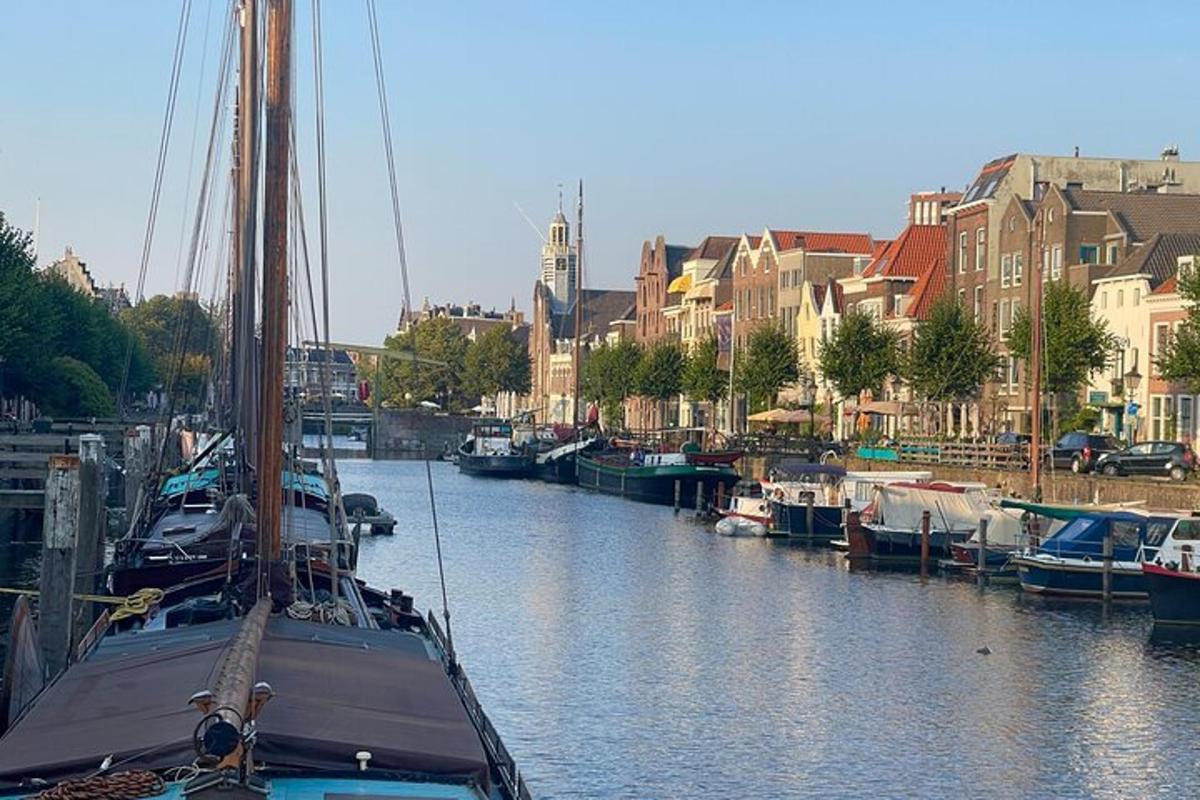 a boat is docked in a river with buildings