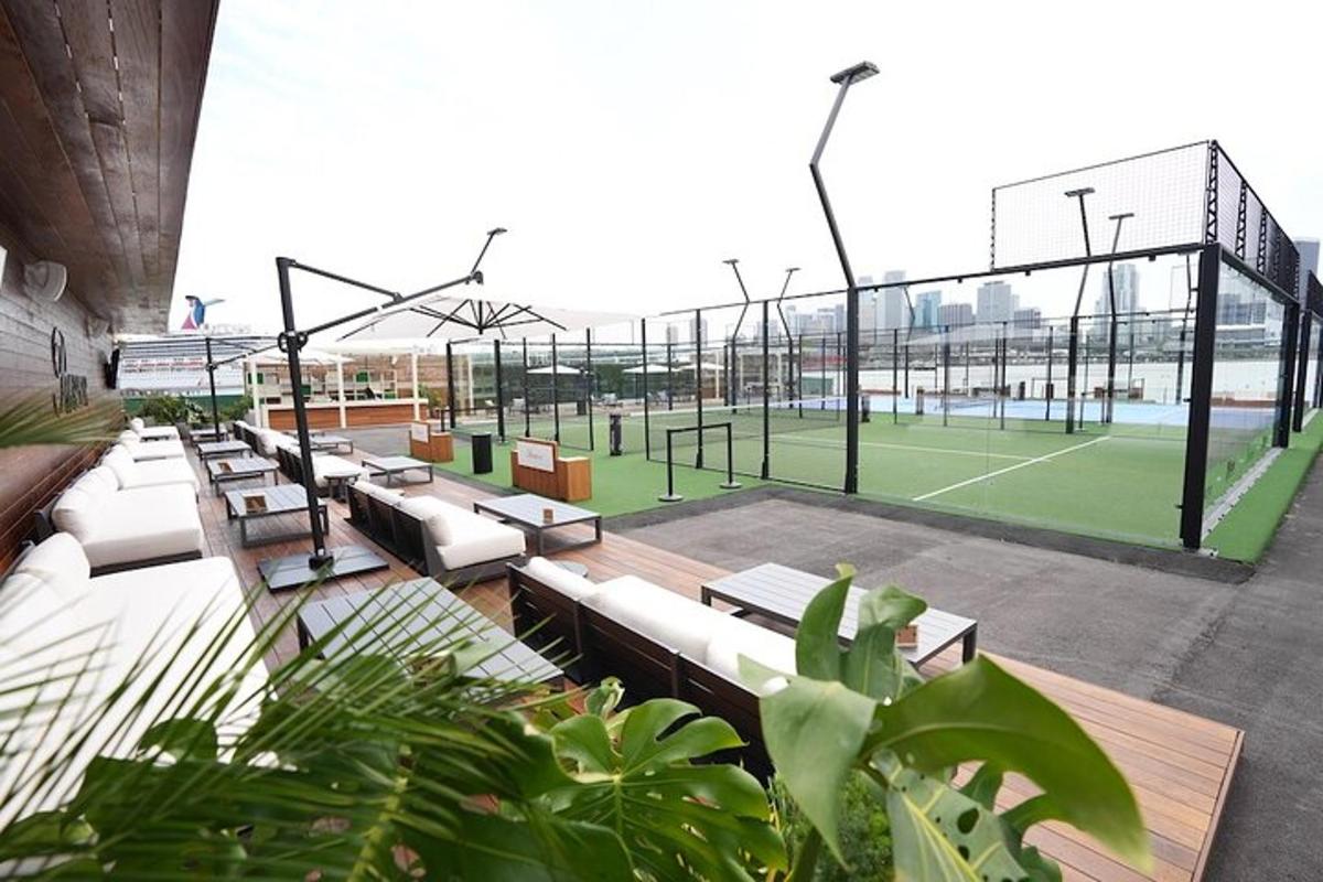 a tennis court with benches on a tennis court