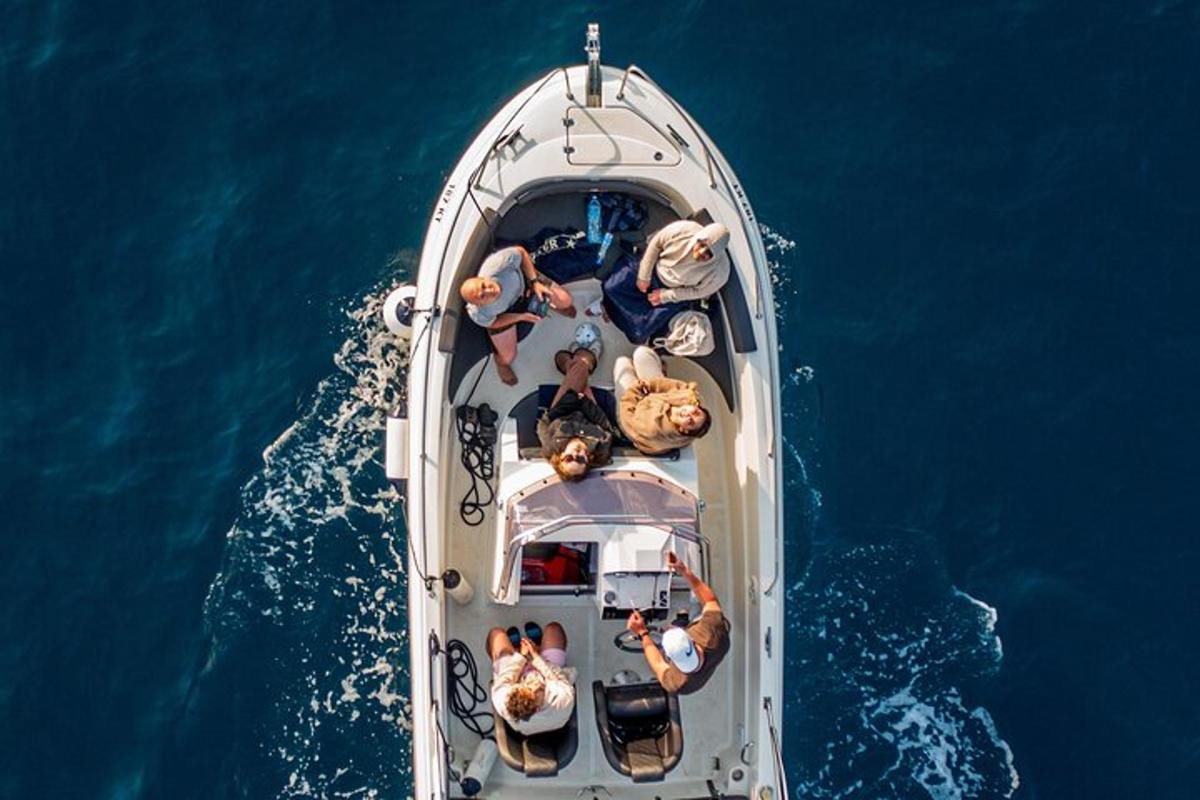 a group of people on a boat in the water