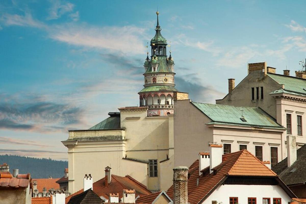 a large building with a tower on top of roofs